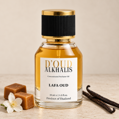 LAFA OUD perfume oil by Alkhalis in a glass bottle with a black and gold cap, displayed with caramel, vanilla pods and a white flower.